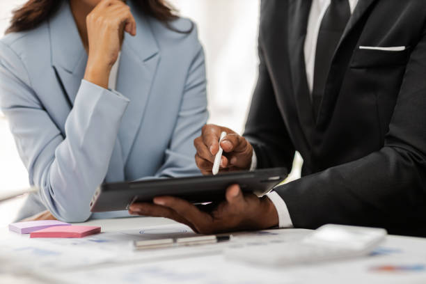 istock Business colleagues working and analyzing financial figures on a digital tablet. Analysis business financial report on digital tablet discussion meeting corporate showing results of their successful. 2190942810