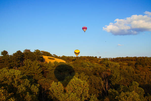 istock Two Hot Air Balloons Over A Mountain 2190946231