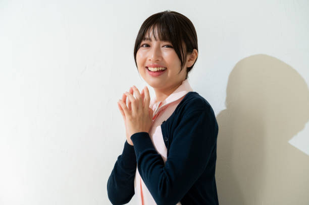 istock Japanese clinic staff smiling on a white background 2190946401