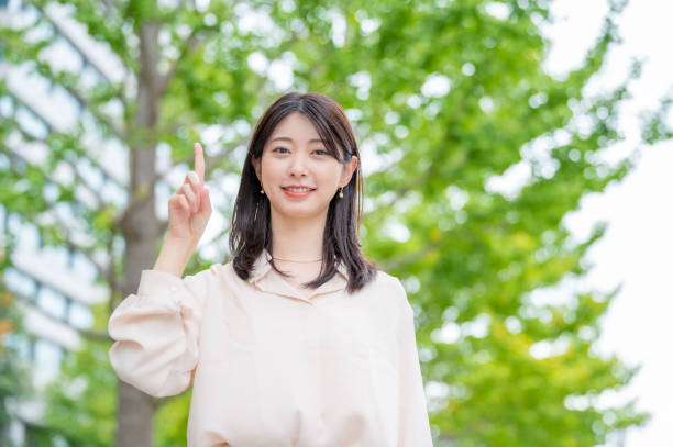 istock A Japanese woman pointing her finger outside 2190948611