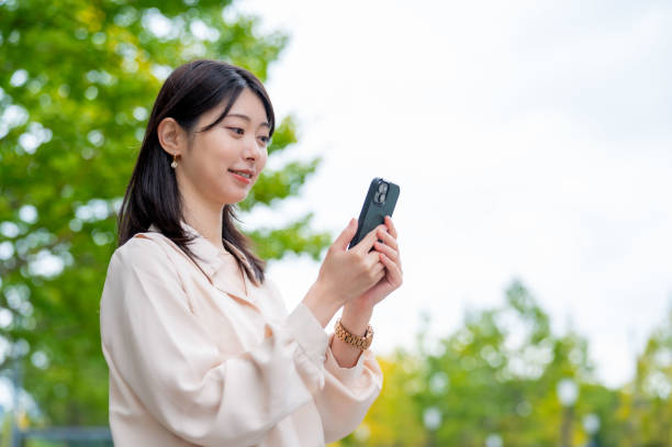 istock A Japanese woman operating a smartphone outside 2190948650
