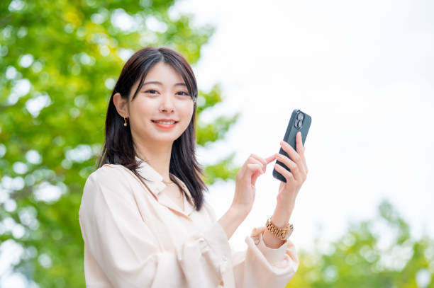 istock A Japanese woman operating a smartphone outside 2190948659