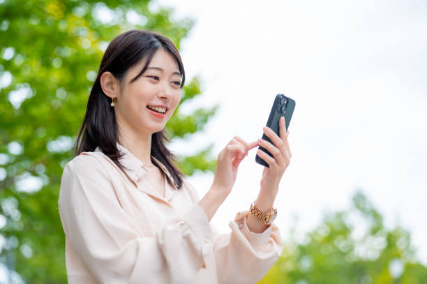 istock A Japanese woman operating a smartphone outside 2190948662