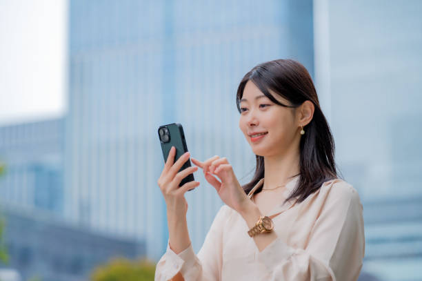 istock A Japanese woman operating a smartphone outside 2190948678