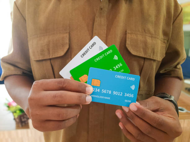 istock Civil Servant Holding Multiple Credit Cards for Financial Management 2190949112
