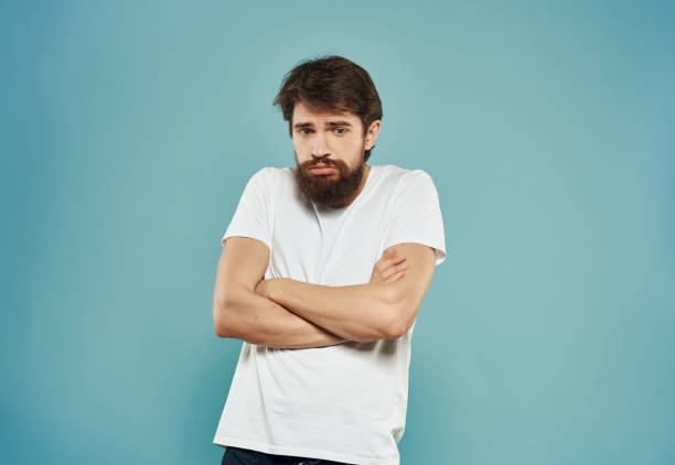 istock emotional man in a white t-shirt expressive look discontent close-up 2190949891