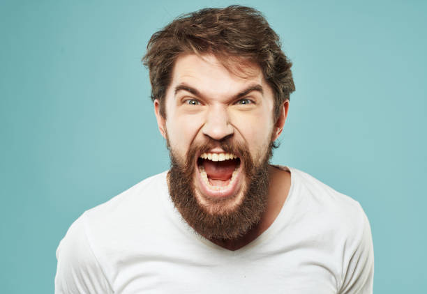 istock emotional man in a white t-shirt expressive look discontent Lifestyle 2190950149