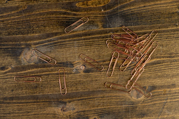 paper clips for the systematization of documents and paper, large-size copper paper clips on the board