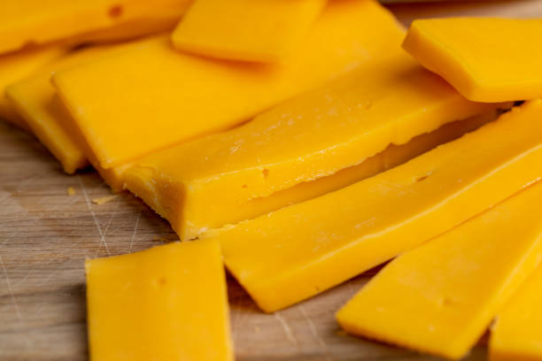 istock slicing yellow cheese close-up 2190951774