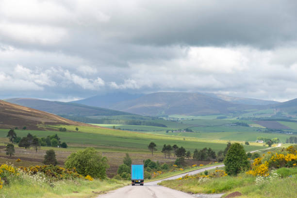 istock Truck in landscape with rolling green hills 2190952410