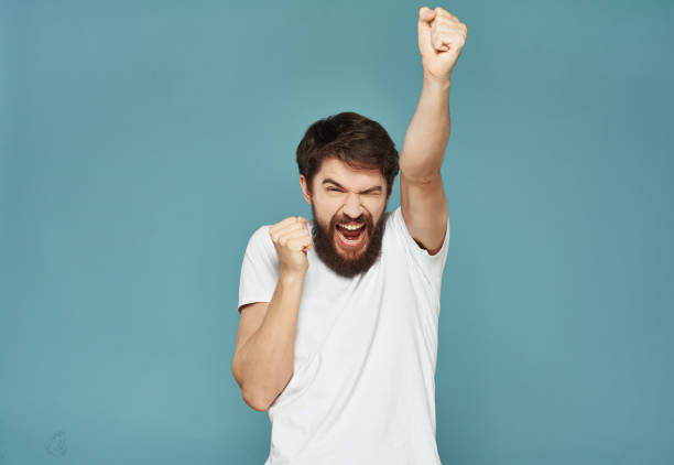 istock bearded man in a white t-shirt hand gestures anger Lifestyle 2190952608
