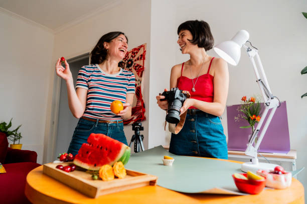 istock Photographer and assistant talking during photo shoot 2190953870
