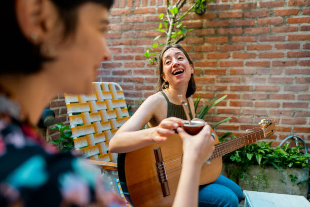 Female friends talking in the backyard