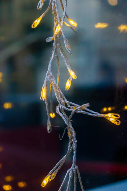 istock Close-Up of Illuminated Decorative String Lights Against a Soft Blurry Background 2190956351