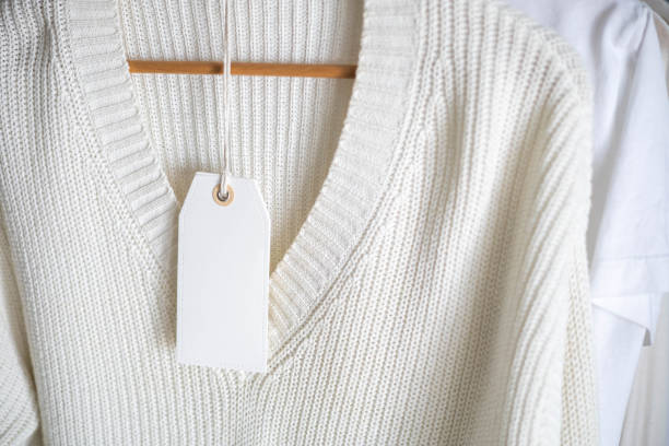 istock White knitted clothing with blank label. 2190958653