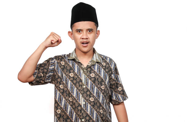 istock A man wearing a patterned shirt and a traditional black cap. 2190958921
