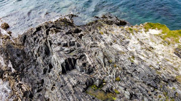 istock Rocks on the seashore. Geological formations, top view. 2190959081