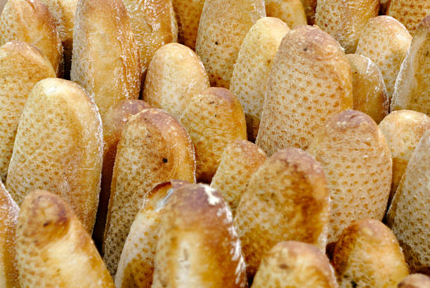 A lot of fresh wheat baguettes, traditional French bread