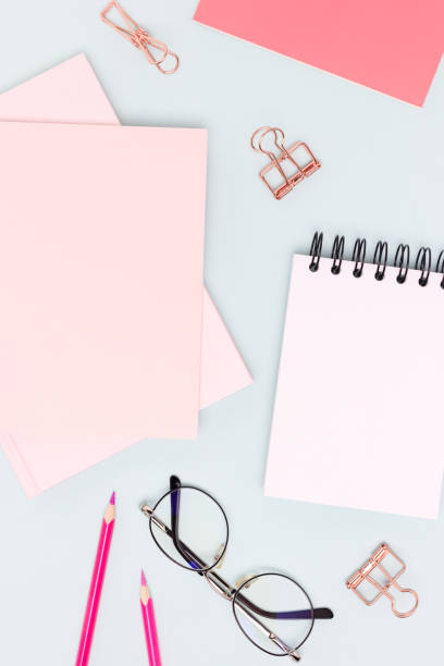 istock Pink colored school supplies on a blue background. 2190961904