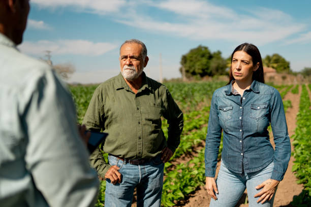 istock Farmers talking at agricultural field 2190962002