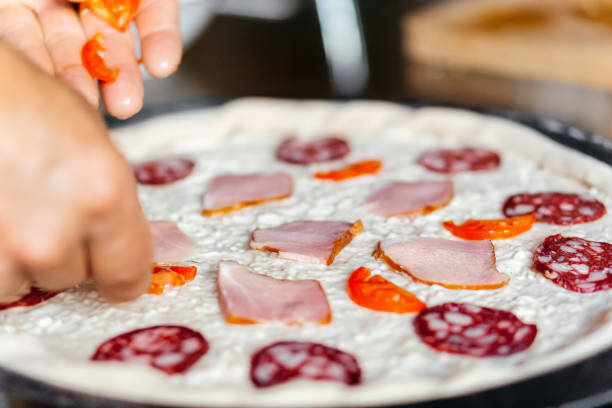 Making cooking pizza fresh ingredients homemade. High quality photo