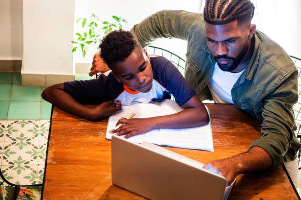 istock Father helping son during homeschooling 2190963587