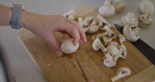 istock Shot from Above of Chef Slicing Mushrooms 2190964324