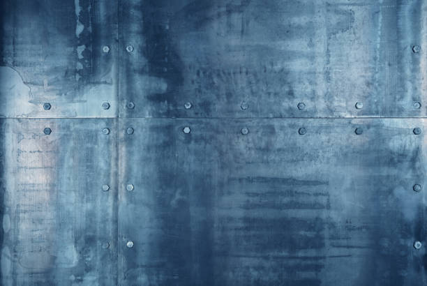 Weathered blue metal panels bolted together creating a textured background