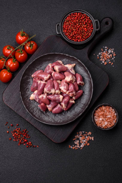 istock Raw chicken hearts with salt, spices and herbs 2190967514