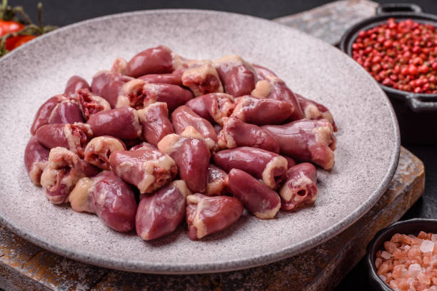 istock Raw chicken hearts with salt, spices and herbs 2190967549
