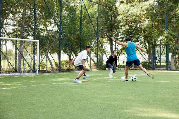 istock A man strikes the soccer ball during a friendly weekend match. 2190967963
