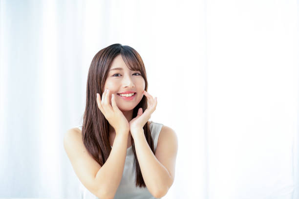istock A Japanese woman checking her skin 2190969235