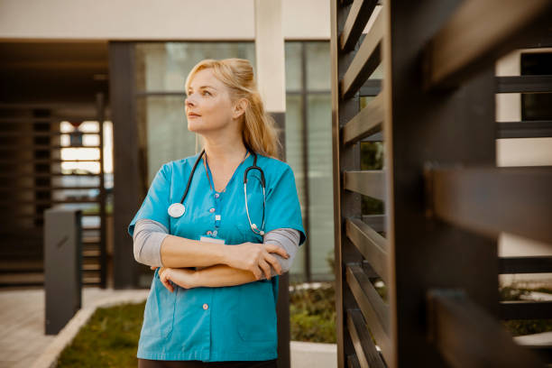 istock Woman in blue scrubs Medicine worker 2190969548