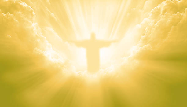 istock Jesus Christ In The Clouds on gold sky background 2190970233