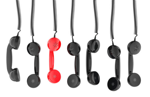 istock Red phone handset with others black phone handsets hanging. 3D rendering 2190970259