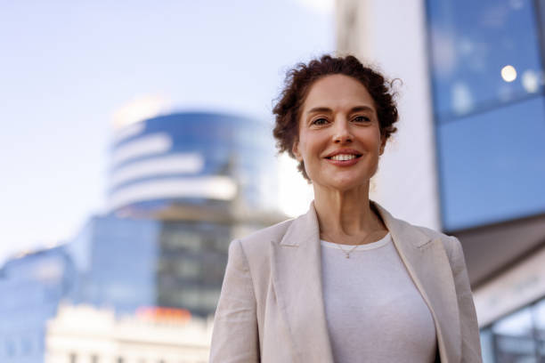 istock Elegant Mature Woman Posing Confidently in Urban Setting 2190970613
