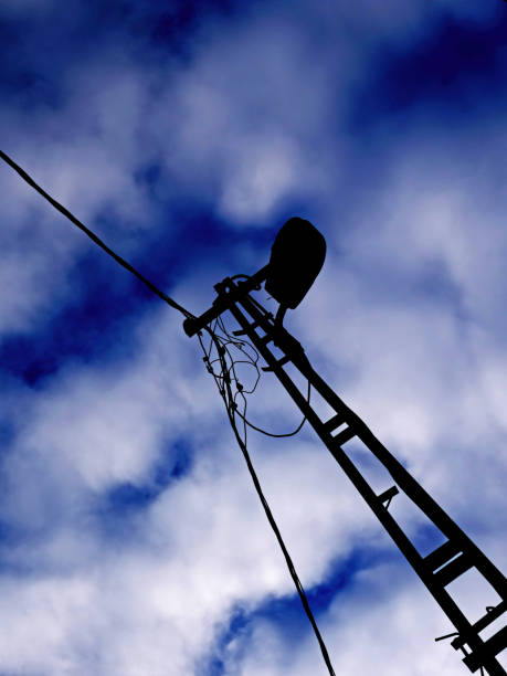 istock silhouette of a lamppost against the sky 2190971698