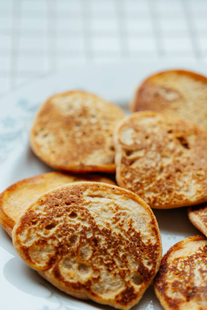 istock fried pancakes on plate on kitchen table, breakfast on sunny morning. healthy eating, vegetarian 2190973753