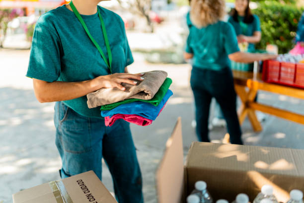 istock Close-up of volunteer organizing donation boxes 2190973934