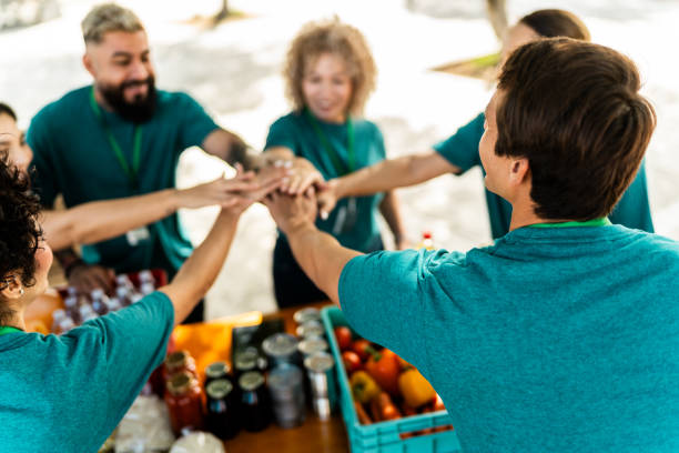 istock Volunteers with hands togethers outdoors 2190974243