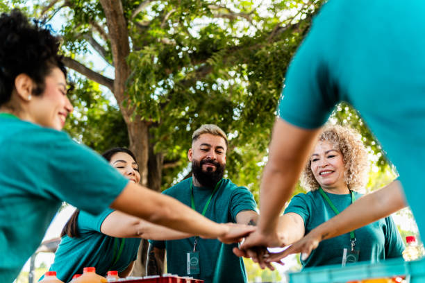 istock Volunteers with hands togethers outdoors 2190974283