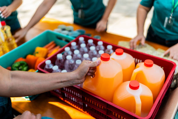 Close-up of volunteers organizing donation boxes