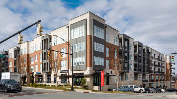 Hickory, North Carolina, USA-19 Dec. 2024: One North Center, mixed use building includes apartments and ground floor commercial space.  Visible are apartments with covered cantilevered patios, Athletique, Next Gen Lending, and True North Realty.