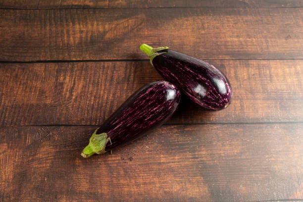 istock Whole eggplant on wooden background 2190976593