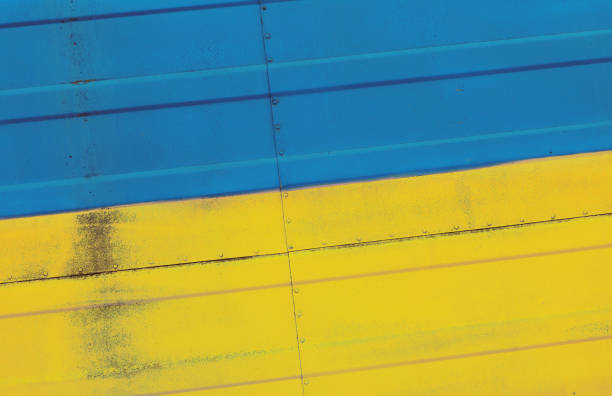 istock Ukrainian flag painted on a corrugated metal surface 2190977614