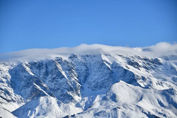 istock French alps on a sunny day under the clouds by winter covered with snow 2190977696