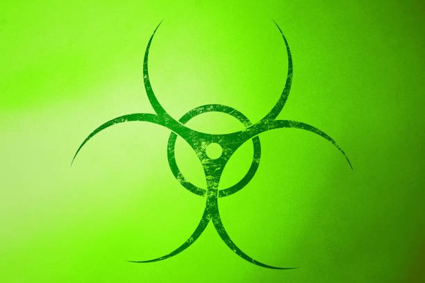 Green biohazard symbol warning of biological risks, representing potential danger and the need for caution in handling hazardous materials, on a vibrant green backdrop