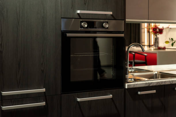 istock Stainless steel built-in oven with digital display and smooth finish 2190987936