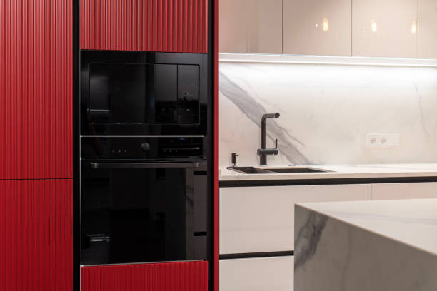 istock Modern black built-in oven and microwave in a red kitchen 2190987974
