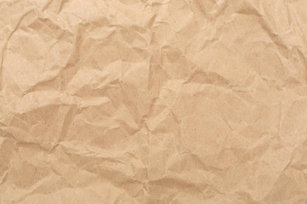 Crumpled craft paper as background, top view